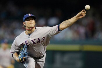 HOUSTON - JUNE 28:  Pitcher C.J. Wilson #36 of the Texas Rangers throws against the Houston Astros in the first inning at Minute Maid Park on June 28, 2011 in Houston, Texas.  (Photo by Bob Levey/Getty Images)