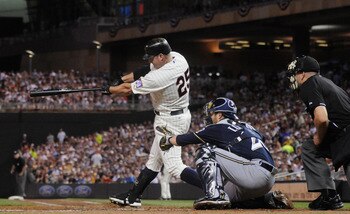 MINNEAPOLIS, MN - JULY 1: Jim Thome #25 of the Minnesota Twins hits a three-run home run as Jonathan Lucroy #20 of the Milwaukee Brewers catches in the first inning on July 1, 2011 at Target Field in Minneapolis, Minnesota. (Photo by Hannah Foslien/Getty