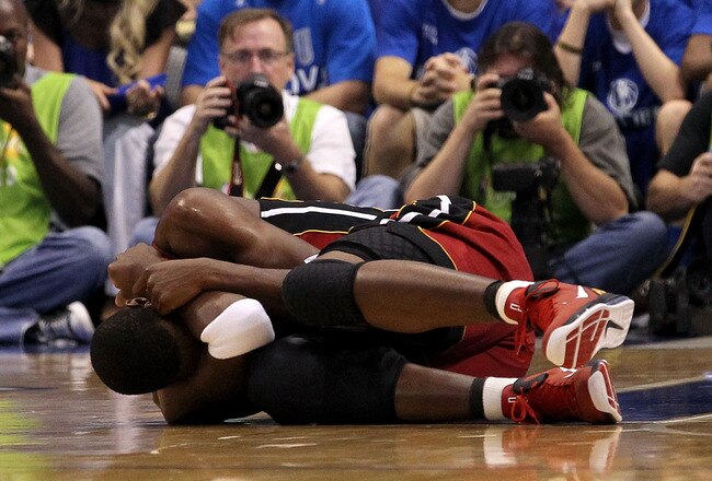 DALLAS, TX - JUNE 05:  Chris Bosh #1 of the Miami Heat lays on the floor after an injury in the first quarter while taking on the Dallas Mavericks in Game Three of the 2011 NBA Finals at American Airlines Center on June 5, 2011 in Dallas, Texas.  NOTE TO