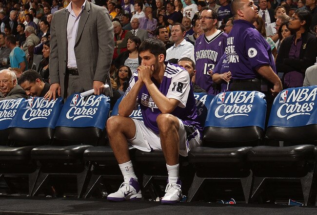 SACRAMENTO, CA - APRIL 13:  Omri Casspi #18 and Samuel Dalembert #10 of the Sacramento Kings look on against the Los Angeles Lakers on April 13, 2011 at Power Balence Pavilion in Sacramento, California. NOTE TO USER: User expressly acknowledges and agrees