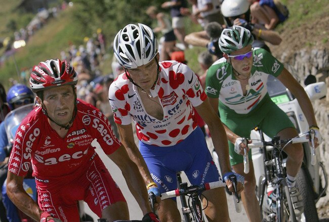 LE GRAND BORNAND, FRANCE - JULY 22:  Gilberto Simoni of Italy and riding for Saeco, Richard Virenque of France and riding for Quick Step Davitamon and Christophe Moreau of France and riding for Credit Agricole spend the waning moments of their escape grou