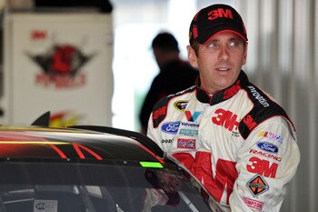 LONG POND, PA - JUNE 10:  Greg Biffle, driver of the #16 3M Ford, climbs into his car in the garage area during practice for the NASCAR Sprint Cup Series 5-Hour Energy 500 at Pocono Raceway on June 10, 2011 in Long Pond, Pennsylvania.  (Photo by Drew Hall