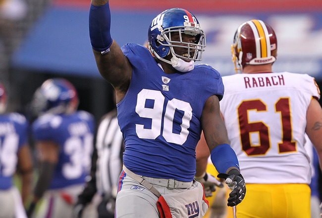 EAST RUTHERFORD, NJ - DECEMBER 05:  Jason Pierre-Paul #90 of the New York Giants celebrates running back a fumble by the Washington Redskins during their game on December 5, 2010 at The New Meadowlands Stadium in East Rutherford, New Jersey.  (Photo by Al