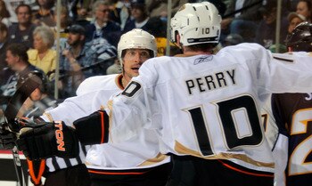 NASHVILLE, TN - APRIL 17:  Corey Perry #10 of the Anaheim Ducks congratulates teammate Teemu Selanne #8 on scoring a goal against the Nashville Predators in Game Three of the Western Conference Quarterfinals during the 2011 NHL Stanley Cup Playoffs at the