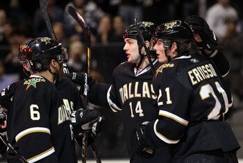 DALLAS, TX - MARCH 09:   Left wing Jamie Benn #14 of the Dallas Stars celebrates a goal with Loui Eriksson #21 against the Calgary Flames at American Airlines Center on March 9, 2011 in Dallas, Texas.  (Photo by Ronald Martinez/Getty Images)