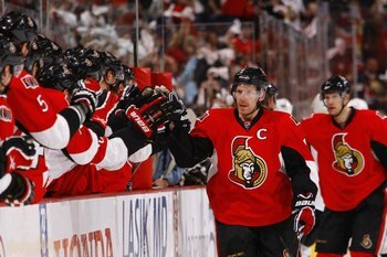 OTTAWA, ON - APRIL 18:  Daniel Alfredsson #11 of the Ottawa Senators celebrates with teammates as he skates by the bench during Game 3 of the Eastern Conference Quaterfinals against the Pittsburgh Penguins in the 2010 Stanley Cup Playoffs at Scotiabank Pl