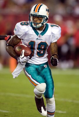 TAMPA, FL - AUGUST 27:  Receiver Ted Ginn, Jr. #19 of the Miami Dolphins runs the ball on a kick off against the Tampa Bay Buccaneers during a preseason game at Raymond James Stadium on August 27, 2009 in Tampa, Florida.  (Photo by J. Meric/Getty Images)