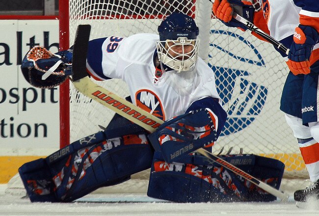 NEWARK, NJ - MARCH 30:  Rick DiPietro #39 of the New York Islanders tends net against the New Jersey Devils at the Prudential Center on March 30, 2011 in Newark, New Jersey. The Devils defeated the Islanders 3-2.  (Photo by Bruce Bennett/Getty Images)