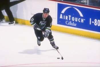 31 Jan 1997:  Leftwinger Geoff Sanderson of the Hartford Whalers moves the puck during a game against the Anaheim Mighty Ducks at Arrowhead Pond in Anaheim, California.  The Ducks won the game, 6-3. Mandatory Credit: Todd Warshaw  /Allsport