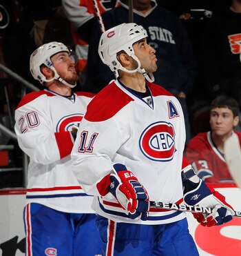 PHILADELPHIA, PA - JANUARY 25:  Scott Gomez #11 and James Wisniewski #20 of the Montreal Canadiens look up at the scoreboard during an NHL hockey game against the Philadelphia Flyers at the Wells Fargo Center on January 25, 2011 in Philadelphia, Pennsylva