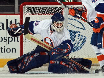 NEWARK, NJ - MARCH 30:  Rick DiPietro #39 of the New York Islanders tends net against the New Jersey Devils at the Prudential Center on March 30, 2011 in Newark, New Jersey. The Devils defeated the Islanders 3-2.  (Photo by Bruce Bennett/Getty Images)