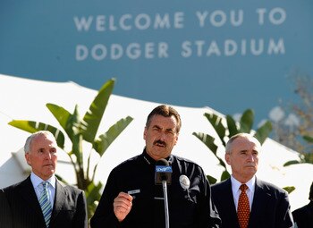 LOS ANGELES, CA - APRIL 14:  Los Angeles Police Department Chief Charlie Beck (C) speaks during a news conference at Los Angeles Dodger Stadium as Los Angeles Dodgers owner Frank McCourt (L) and former LAPD chief William Bratton listen prior to a game bet