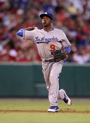ANAHEIM, CA - JULY 02:  Dee Gordon #9 of the Los Angeles Dodgers throws to first base against the Los Angeles Angels of Anaheim at Angel Stadium of Anaheim on July 2, 2011 in Anaheim, California.  (Photo by Jeff Gross/Getty Images)