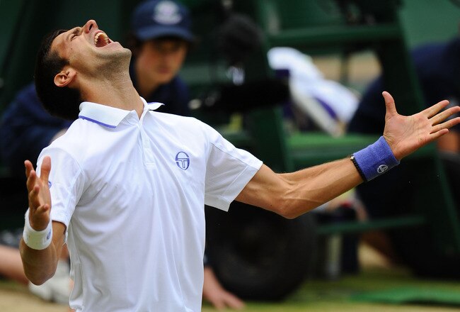 LONDON, ENGLAND - JULY 01:  Novak Djokovic of Serbia celebrates after winning his semifinal round match against Jo-Wilfried Tsonga of France on Day Eleven of the Wimbledon Lawn Tennis Championships at the All England Lawn Tennis and Croquet Club on July 1