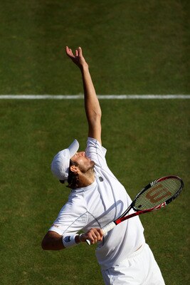 LONDON, ENGLAND - JUNE 29:   Mardy Fish of the United States serves during his quaterfinal round match against Rafael Nadal of Spain on Day Nine of the Wimbledon Lawn Tennis Championships at the All England Lawn Tennis and Croquet Club on June 29, 2011 in