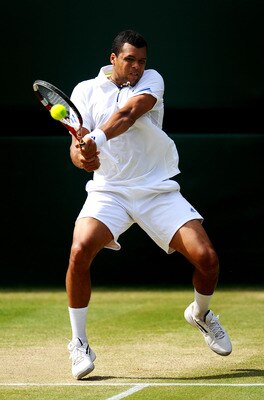 LONDON, ENGLAND - JULY 01:  Jo-Wilfried Tsonga of France returns a shot during his semifinal round match against Novak Djokovic of Serbia on Day Eleven of the Wimbledon Lawn Tennis Championships at the All England Lawn Tennis and Croquet Club on July 1, 2