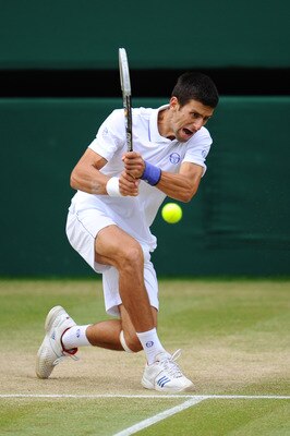 LONDON, ENGLAND - JULY 01:  Novak Djokovic of Serbia returns a shot during his semifinal round match against Jo-Wilfried Tsonga of France on Day Eleven of the Wimbledon Lawn Tennis Championships at the All England Lawn Tennis and Croquet Club on July 1, 2