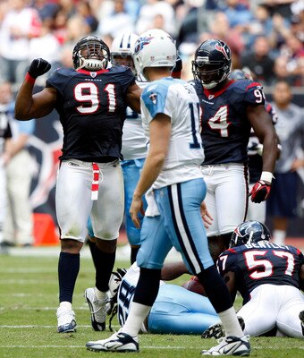 HOUSTON - NOVEMBER 28:  Defensive tackle Amobi Akoye #91 of the Houston Texans celebrates after makeing a tackle against the Tennessee Titans at Reliant Stadium on November 28, 2010 in Houston, Texas.  (Photo by Bob Levey/Getty Images)
