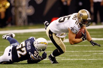 NEW ORLEANS - AUGUST 27:  Larry English #52 of the San Diego Chargers tackles David Thomas #85 of the New Orleans Saints at the Louisiana Superdome on August 27, 2010 in New Orleans, Louisiana.  (Photo by Chris Graythen/Getty Images)