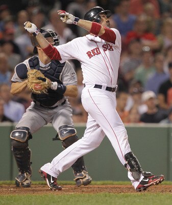 BOSTON, MA  - JUNE 20:  Adrian Gonzalez #28 of the Boston Red Sox connects for a one-run double against the San Diego Padres at Fenway Park on June 20, 2011 in Boston, Massachusetts.  (Photo by Jim Rogash/Getty Images)