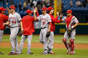 ST. PETERSBURG, FL - MAY 01:  Pitcher Jordan Walden #51 of the Los Angeles Angels of Anaheim is congratulated by his teammates after their victory over the Tampa Bay Rays during the game at Tropicana Field on May 1, 2011 in St. Petersburg, Florida.  (Phot