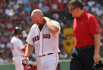 BOSTON, MA  - JULY 4:  Kevin Youkilis #20 of the Boston Red Sox leaves the game after being hit by a pitch against the Toronto Blue Jays at Fenway Park on July 4, 2011 in Boston, Massachusetts.  (Photo by Jim Rogash/Getty Images)