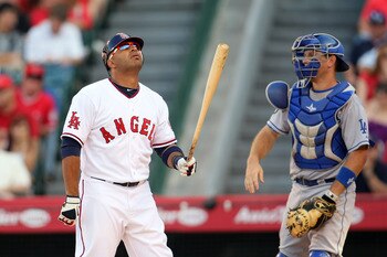 ANAHEIM, CA - JULY 03:  Vernon Wells #10 of the of the Los Angeles Angels of Anaheim reacts after missing on his swing as catcher A.J. Lewis #17 Los Angeles Dodgers looks on in the bottom of the second inning during the MLB game between the Los Angeles Do