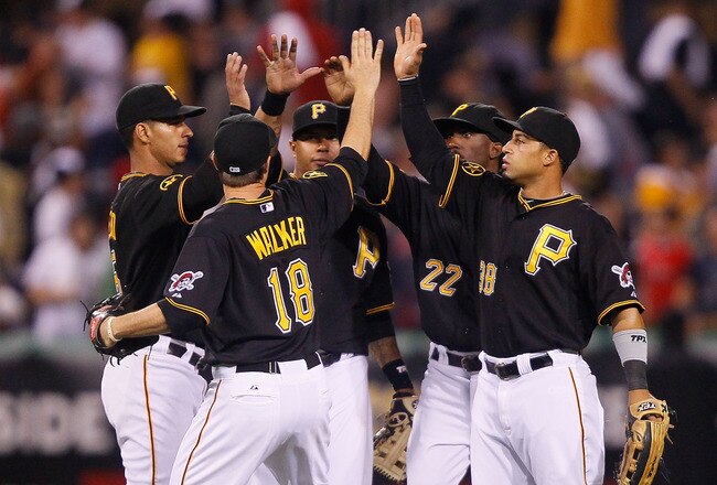 PITTSBURGH - JUNE 24:  Ronny Cedeno #5, Neil Walker #18, Jose Tabata #31, Andrew McCutchen #22, and Xavier Paul #38 of the Pittsburgh Pirates celebrate in center field after their win against the Boston Red Sox on June 24, 2011 at PNC Park in Pittsburgh,