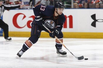 EDMONTON, CANADA - MARCH 17: Andrew Cogliano #13 of the Edmonton Oilers skates with the puck against the Phoenix Coyotes on March 17, 2011 at Rexall Place in Edmonton, Alberta, Canada. (Photo by Dale MacMillan/Getty Images)