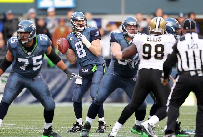 SEATTLE, WA - JANUARY 08:  Matt Hasselbeck #8 of the Seattle Seahawks scrambles against the New Orleans Saints during the 2011 NFC wild-card playoff game at Qwest Field on January 8, 2011 in Seattle, Washington.  (Photo by Otto Greule Jr/Getty Images)
