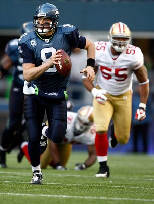 SEATTLE , WA - DECEMBER 06:  Quarterback Matt Hasselbeck #8 of the Seattle Seahawks runs with the ball against the San Francisco 49ers at Qwest Field on December 6, 2009 in Seattle, Washington.  (Photo by Jonathan Ferrey/Getty Images)