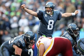 SEATTLE - JANUARY 05:  Quarterback Matt Hasselbeck #8 of the Seattle Seahawks calls out under center in the first quarter against the Washington Redskins during the NFC Wild Card game at Qwest Field on January 5, 2008 in Seattle, Washington.  (Photo by Je