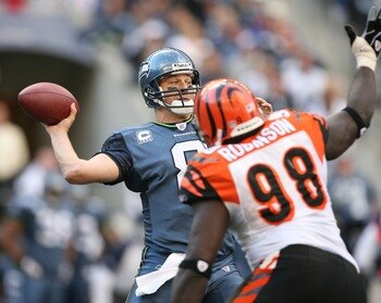 SEATTLE - SEPTEMBER 23:  Quarterback Matt Hasselbeck #8 of the Seattle Seahawks passes against Bryan Robinson #98 of the Cincinnati Bengals at Qwest Field on September 23, 2007 in Seattle, Washington. The Seahawks defeated the Bengals 24-21. (Photo by Ott