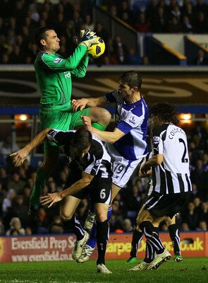 BIRMINGHAM, ENGLAND - FEBRUARY 15:  Goalkeeper Steve Harper of Newcastle United wins the ball ahead of Nikola Zigic (2nd R) of Birmingham during the Barclays Premier League match between Birmingham City and Newcastle United at St Andrews on February 15, 2