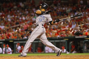 ST. LOUIS, MO - JUNE 24: Jose Bautista #19 of the Toronto Blue Jays hits the game-winning home run against the St. Louis Cardinals at Busch Stadium on June 24, 2011 in St. Louis, Missouri.  (Photo by Dilip Vishwanat/Getty Images)