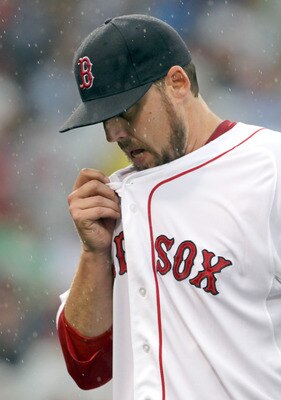 BOSTON, MA  - JUNE 22:  John Lackey #41 of the Boston Red Sox reacts after being removed from a game against the San Diego Padres at Fenway Park on June 22, 2011 in Boston, Massachusetts.  The go-ahead run scored on the play. (Photo by Jim Rogash/Getty Im
