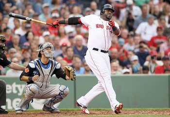 BOSTON, MA - JULY 05:  David Ortiz #34 of the Boston Red Sox hits a double in the second inning as J.P. Arencibia #9 of the Toronto Blue Jays catches on July 5, 2011 at Fenway Park in Boston, Massachusetts.  (Photo by Elsa/Getty Images)