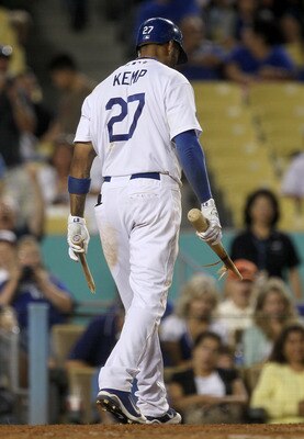 LOS ANGELES, CA - JULY 5:  Matt Kemp #27 of the Los Angeles Dodgers walks off the field with his broken bat in his hands after breaking it over his knee after striking out to end the game with the New York Mets  on July 5, 2011 at Dodger Stadium in Los An