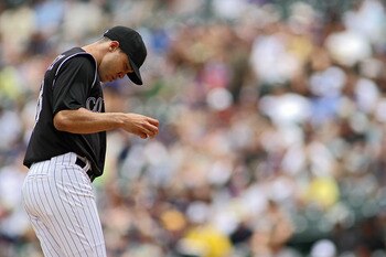 DENVER, CO - JUNE 12: Starting pitcher Ubaldo Jimenez #38 of the Colorado Rockies got off to a rough start by giving up a grand slam home run to James Loney of the Los Angeles Dodgers in the third inning on June 12, 2011 at Coors Field in Denver, Colorado