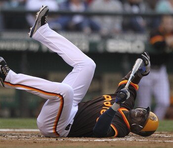 SEATTLE - JULY 01:  Orlando Hudson #1 of the San Diego Padres falls to the ground in pain after being injured on a swing against the Seattle Mariners at Safeco Field on July 1, 2011 in Seattle, Washington. Hudson was removed from the game. (Photo by Otto