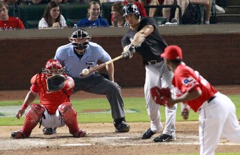 ARLINGTON, TX - JULY 3: Mike Stanton #27 of the Florida Marlins hits a single to center field against the Texas Rangers at Rangers Ballpark in Arlington on July 3, 2011 in Arlington, Texas. (Photo by Rick Yeatts/Getty Images)