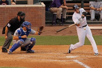 DENVER, CO - JULY 1:  Troy Tulowitzki #2 of the Colorado Rockies his a two-run home run off of starting pitcher Danny Duffy #23 of the Kansas City Royals during the third inning at Coors Field on July 1, 2011 in Denver, Colorado.  (Photo by Justin Edmonds