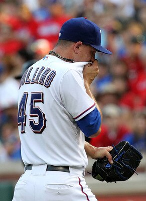 ARLINGTON, TX - JULY 02:  Derek Holland #45 of the Texas Rangers leaves the game against the Florida Marlins in the first inning at Rangers Ballpark in Arlington on July 2, 2011 in Arlington, Texas.  (Photo by Ronald Martinez/Getty Images)