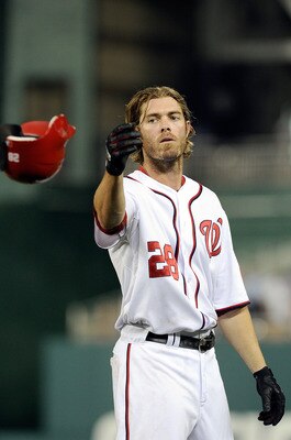 WASHINGTON, DC - JULY 05:  Jayson Werth #28 of the Washington Nationals tosses his helemt after making the final out in the seventh inning against the Chicago Cubs at Nationals Park on July 5, 2011 in Washington, DC. The Nationals won the game 3-2. (Photo