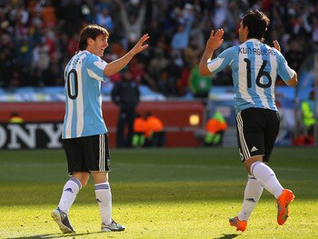 JOHANNESBURG, SOUTH AFRICA - JUNE 17: Lionel Messi of Argentina celebrates with Sergio Aguero of Argentina during the 2010 FIFA World Cup South Africa Group B match between Argentina and South Korea at Soccer City Stadium on June 17, 2010 in Johannesburg,