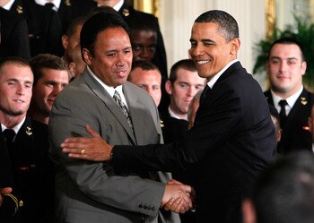 WASHINGTON - MAY 03:  U.S. President Barack Obama (R) greets head coach Ken Niumatalolo (L) as he hosts members of the Navy football team Midshipmen during the presentation ceremony of the Commander-in-Chief's Trophy at the East Room of the White House Ma