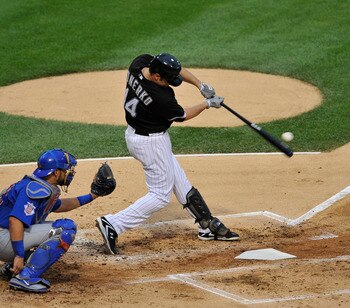 CHICAGO, IL - JUNE 21: Paul Konerko #14 of the Chicago White Sox hits a solo home run against the Chicago Cubs in the second inning on June 21, 2011 at U.S. Cellular Field in Chicago, Illinois.  (Photo by David Banks/Getty Images)