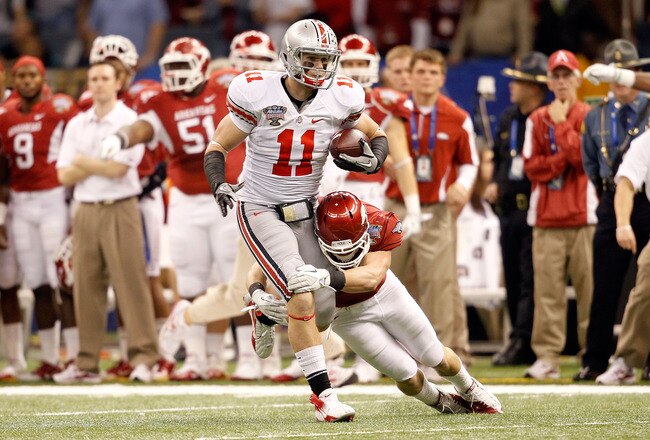 NEW ORLEANS, LA - JANUARY 04:  Jake Stoneburner #11 of the Ohio State Buckeyes runs after a catch against the Arkansas Razorbacks in the first quarter in the Allstate Sugar Bowl at the Louisiana Superdome on January 4, 2011 in New Orleans, Louisiana.  (Ph