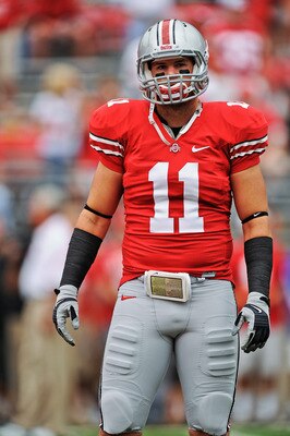 COLUMBUS, OH - SEPTEMBER 11:  Jake Stoneburner #11 of the Ohio State Buckeyes warms up before a game against the Miami Hurricanes at Ohio Stadium on September 11, 2010 in Columbus, Ohio.  (Photo by Jamie Sabau/Getty Images)