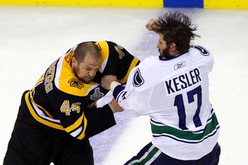 BOSTON, MA - JUNE 06:  Ryan Kesler #17 of the Vancouver Canucks fights with Dennis Seidenberg #44 of the Boston Bruins during Game Three of the 2011 NHL Stanley Cup Final at TD Garden on June 6, 2011 in Boston, Massachusetts.  (Photo by Bruce Bennett/Gett